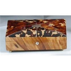 An early Victorian tortoiseshell trinket box, the slightly domed rectangular lid with radiating whi.