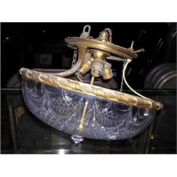 A 20th century gilt metal mounted cut glass ceiling dish, the three sockets held below three downsw.