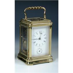 A late 19th century French alarum carriage clock with leather case, the eight day movement in glaze.