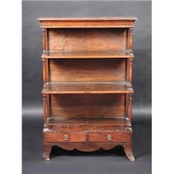 A 19th century mahogany and stained pine waterfall bookcase, the moulded rectangular top above thre.