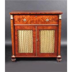 A Regency mahogany secretaire cabinet, the rectangular top above a gilt metal mounted secretaire dr.