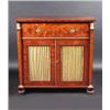 A Regency mahogany secretaire cabinet, the rectangular top above a gilt metal mounted secretaire dr.