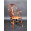 Image 1 : A 19th century yew wood and elm Windsor armchair, the arched spindle turned back with pierced round.