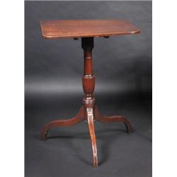 A Regency mahogany side table, the rounded rectangular top supported on a turned baluster column, s.