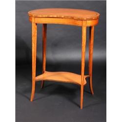 An Edwardian satinwood kidney shaped side table, the line inlaid shaped top with crossbanded edge s.