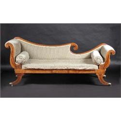 A William IV mahogany framed scroll end settee, the scrolling padded back above padded arms and cus.