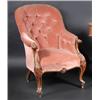 Image 1 : An early Victorian walnut framed armchair, the arched button padded back above downswept scrolling..