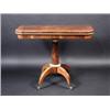 Image 1 : A Regency rosewood card table, the rounded rectangular baize lined fold over top above a plain frie.