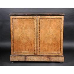 A Victorian walnut cabinet, the moulded rectangular top above a pair of gilt metal mounted and marq.