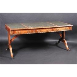 A mahogany library table, the moulded rectangular leather inset top above three frieze drawers oppo.