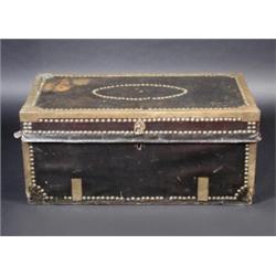 A close nailed and brass mounted leather trunk, of typical construction, 75cm wide  £150-200...