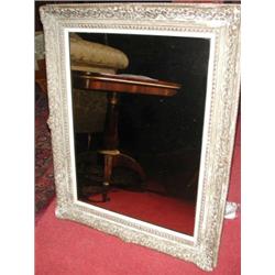 A gilt framed wall glass, the rectangular plate within a moulded frame, 100cm wide  £150-200...