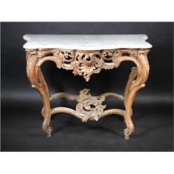 An 18th century North Italian carved wood serpentine pier table, the moulded shaped white marble to.