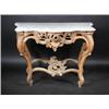An 18th century North Italian carved wood serpentine pier table, the moulded shaped white marble to.