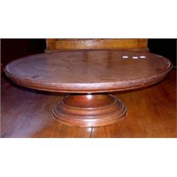 A 19th century mahogany lazy Susan, the dished circular top supported on a moulded pedestal, 53cm d.