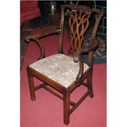 A George III mahogany open armchair, the carved scrolling top rail above a carved pierced splat, sc.