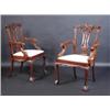 Image 1 : A set of twelve mahogany dining chairs, including two carvers, each with acanthus carved scrolling..