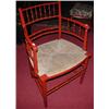 Image 1 : A red painted faux bamboo open armchair, the spindle back above a double rail, bowed arms and reede.