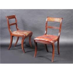 A William IV rosewood breakfast table, the circular tilt top supported on a tapering hexagonal colu.