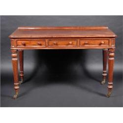A William IV mahogany side table, the moulded rounded rectangular top above three frieze drawers su.