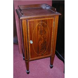 An Edwardian mahogany bedside cupboard, the square top with three quarter gallery above an inlaid d.