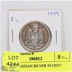 1959 CANADIAN SILVER 50 CENT PIECE.