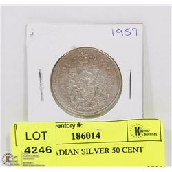 1959 CANADIAN SILVER 50 CENT PIECE.