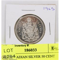 1965 CANADIAN SILVER 50 CENT PIECE.