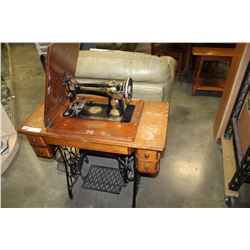 SINGER SEWING MACHINE WITH TREADLE BASE IN CABINET