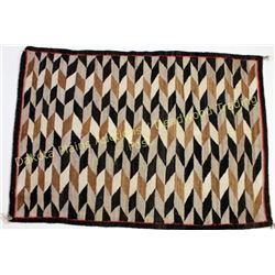 Good Navajo rug in tan, white and brown's, diamond pattern showing good overall condition, 36  X 51 