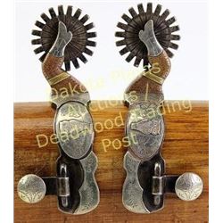 Pair double mounted gal leg spurs Owl pattern, by Brad Erickson, stamped below buttons.  Est. 300-50