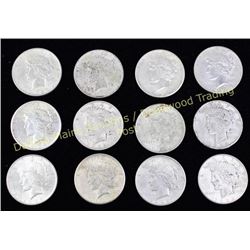 12 silver Peace dollars including 7) 1922 1) 1923 and 3) 1926.  Est. 120-200