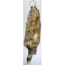Pair of nicely tanned red fox pelts complete with tails.  Est. 75-150