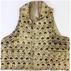 Early cloth fancy gambles vest unmarked with pockets and faceted green with clear glass buttons. Ins