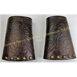 Early unmarked cowboy cuffs tooled with brass spots, showing period use, great patina.  Est. 50-150