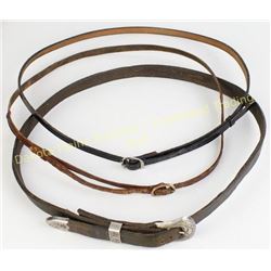Three leather hat bands one with sterling ranger buckle.  Est. 50-100