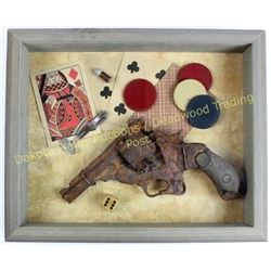 Shadow boxed relic top break revolver displayed with old gambling items.  Est. 75-100