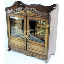 Small antique smokers tobacco cabinet oak, beveled glass double doors, fitted interior with four dra