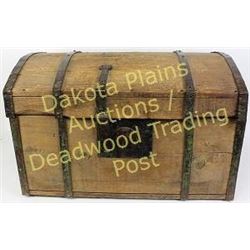 Early wood dome top stage coach trunk iron bound, 29” long.  Est. 100-250