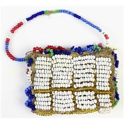 Tiny Sioux beaded childs toy bag 1 3/8"X 1 7/8" sinew sewn lazy stitched on native tanned leather, r