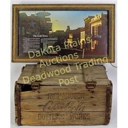 Collection of 2 includes Lead, S.D., Coca-Cola bottle crate and Lead, S.D. Main Street sign showing 