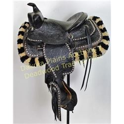 Minty childs black parade saddle fully floral stamped and nickel spotted unmarked with wool tufted c