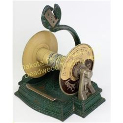 Early dress shop counter top ribbon cutter from Stowell Style Shop, Huron S.D. with remnant of ribbo