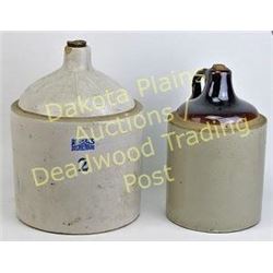 Collection of 2 stoneware whiskey jugs Est. 25-100