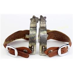 Boone stamped single mounted spurs with short shanks, 5 point rowels, contemporary FA meaned straps,