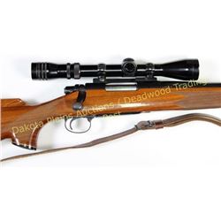 Remington model 700 22-250 SN 6837882 bolt action rifle 24" round barrel blue finish, checkered waln