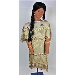 Vintage Plains Indian girls dress on mannequin from an Iowa museum display, dress beaded and fringed