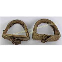 Scarce pair early Crow stirrups leather wrapped over wood, measuring 4"X5".  Est. 200-400
