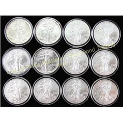 Collection of 12 Walking Liberty silver dollars.  Est. 200-400