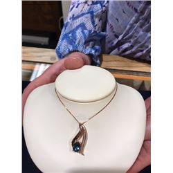 10k 18" rose gold chain with 6 mm X 8 mm Blue Topaz and 28 Diamonds